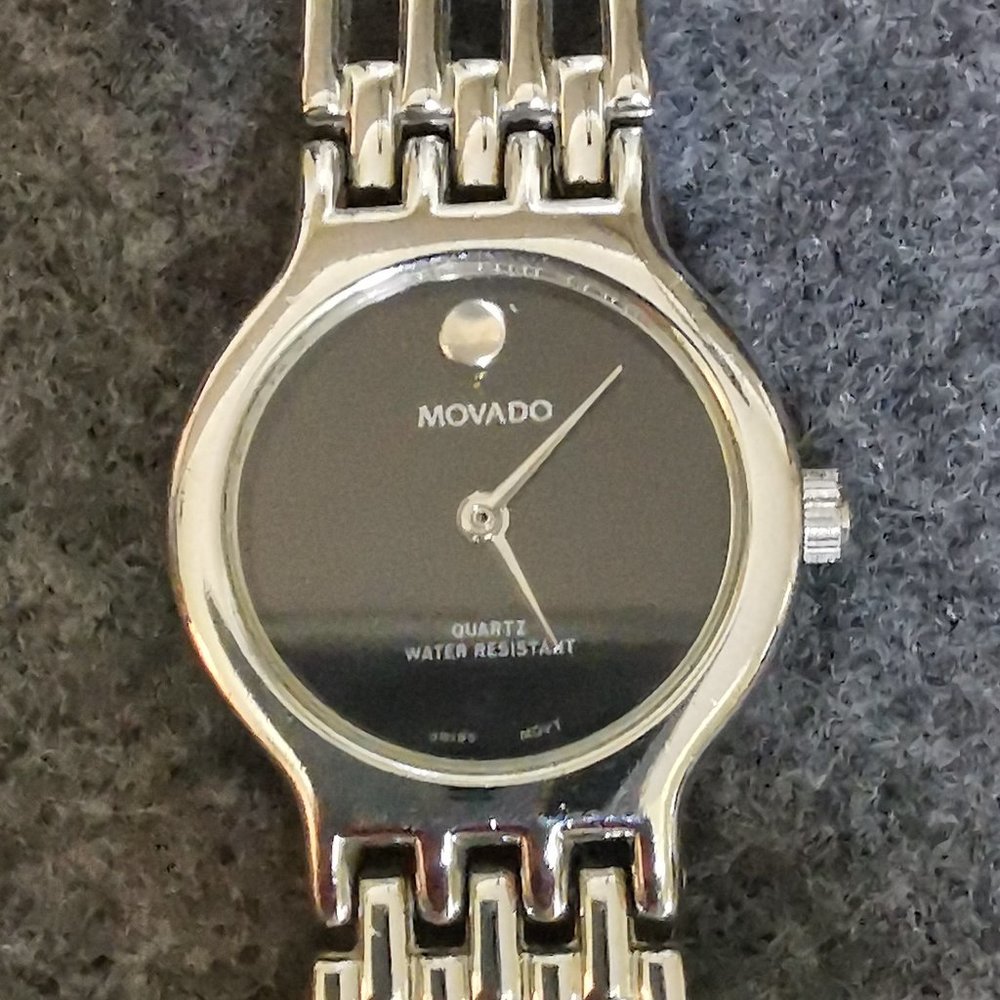 Ladies Movado Watch, stainless steel watch and strap, adjustable, size 7.5 now.